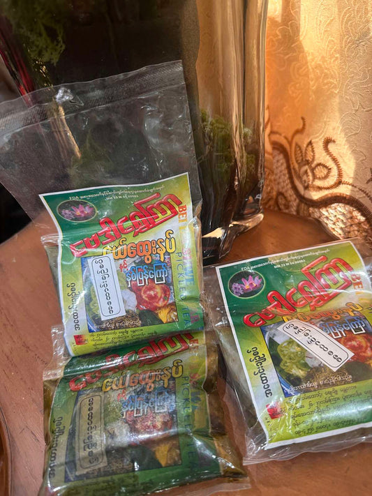 ဗေဒါရွှေကြာ အထောင်းချဥ်စပ် 160g (Bei Da Shwe Kyar A Htaung Spicy Pickled Tea Leaf)